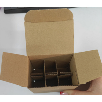 White custom-shaped protective cardboard box for cosmetics with a grid for 24 bottles