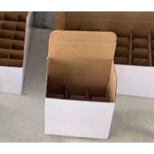 White custom-shaped protective cardboard box for cosmetics with a grid for 24 bottles